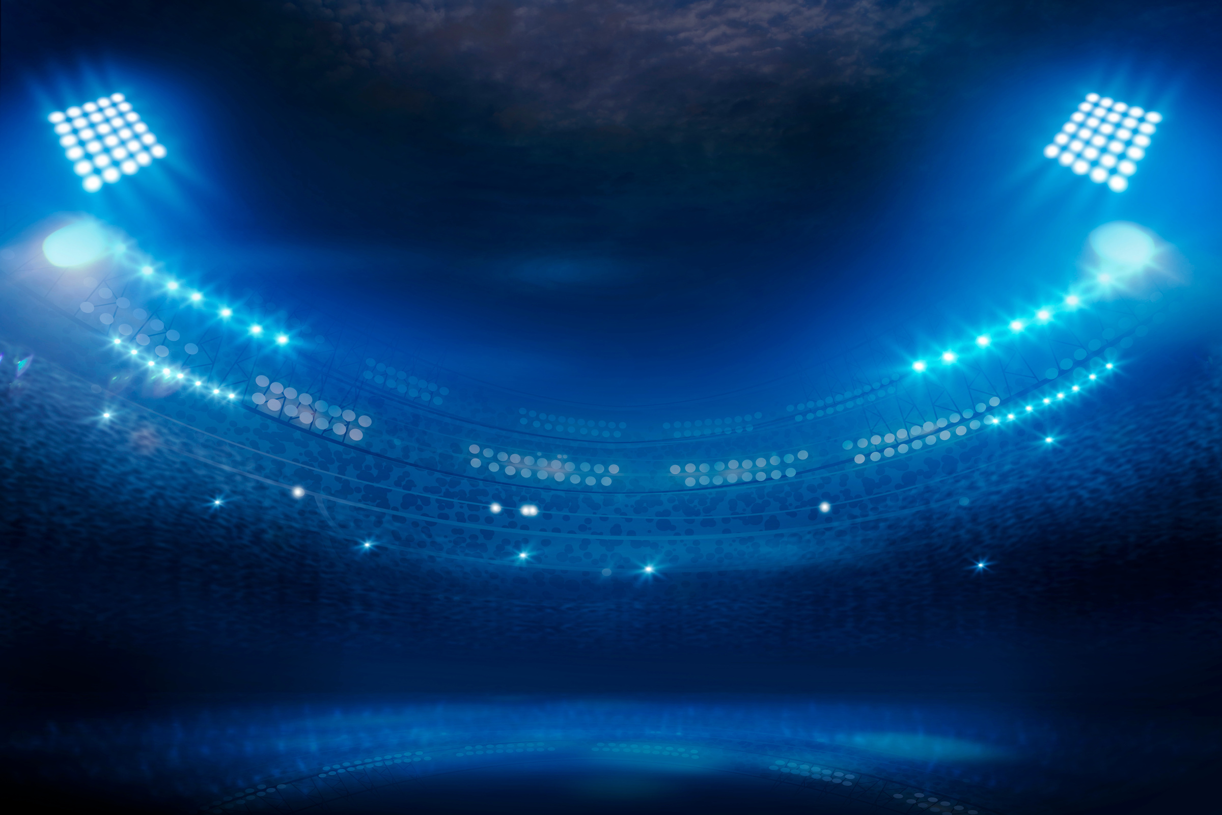 Bright stadium arena lights at night;